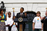 WASHINGTON - SEPTEMBER 16:  U.S. President Barack Obama (C) speaks during an event on the South Lawn of the White House promoting the city of Chicago�s bid for the 2016 Summer Olympics with Chicago Mayor Richard Daley (R) and first lady Michelle Obama September 16, 2009 in Washington, DC. Obama and Daley joined members of the USOC, and representatives from the Chicago2016 group during the event.  (Photo by Win McNamee/Getty Images)