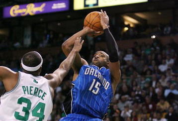 BOSTON - NOVEMBER 20: Vince Carter #15 of the Orlando Magic shoots a jump shot over Paul Pierce #34 of the Boston Celtics during the game on November 20, 2009 at the TD Garden in Boston, Massachusetts. NOTE TO USER: User expressly acknowledges and agrees that, by downloading and or using this photograph, User is consenting to the terms and conditions of the Getty Images License Agreement.  (Photo by Elsa/Getty Images)