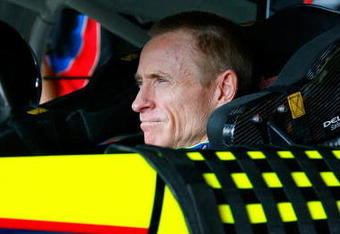HOMESTEAD, FL - NOVEMBER 20:  Mark Martin, driver of the #5 Kellogg's/CARQUEST Chevrolet, sits in his car in the garage prior to practice for the NASCAR Sprint Cup Series Ford 400 at Homestead-Miami Speedway on November 20, 2009 in Homestead, Florida.  (Photo by Jason Smith/Getty Images for NASCAR)