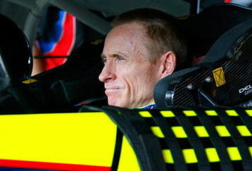 HOMESTEAD, FL - NOVEMBER 20:  Mark Martin, driver of the #5 Kellogg's/CARQUEST Chevrolet, sits in his car in the garage prior to practice for the NASCAR Sprint Cup Series Ford 400 at Homestead-Miami Speedway on November 20, 2009 in Homestead, Florida.  (Photo by Jason Smith/Getty Images for NASCAR)