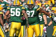 GREEN BAY, WI - OCTOBER 18: Johnny Jolly #97 and  Nick Barnett #56 of the Green Bay Packers celebrate a defensive stop against the Detroit Lions at Lambeau Field on October 18, 2009 in Green Bay, Wisconsin. The Packers defeated the Lions 26-0. (Photo by Jonathan Daniel/Getty Images)