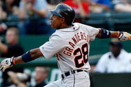 ARLINGTON, TX - JULY 29:  Center fielder Curtis Granderson #28 of the Detroit Tigers hits his second home run of the game in the second inning against the Texas Rangers on July 29, 2009 at Rangers Ballpark in Arlington, Texas.  (Photo by Ronald Martinez/Getty Images)