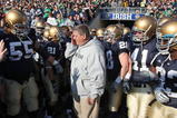 SOUTH BEND, IN - NOVEMBER 21: Head coach Charlie Weis of the Notre Dame Fighting Irish wipes a tear from his eye before lining up to enter the field for a game against the University of Connecticut Huskies at Notre Dame Stadium on November 21, 2009 in South Bend, Indiana. (Photo by Jonathan Daniel/Getty Images