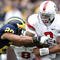 ANN ARBOR, MI - NOVEMBER 21: Terrelle Pryor #2 of the Ohio State Buckeyes tries to get around Troy Woolfolk #29 of the Michigan Wolverines on November 21, 2009 at Michigan Stadium in Ann Arbor, Michigan. (Photo by Gregory Shamus/Getty Images)