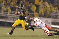 COLUMBIA, MO - OCTOBER 08:  Derrick Washington #2 of the Missouri Tigers carries the ball against Larry Asante #4 of the Nebraska Cornhuskers on October 8, 2009 at Faurot Field/Memorial Stadium in Columbia, Missouri. (Photo by Jamie Squire/Getty Images)