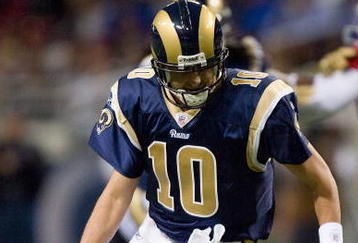 ST. LOUIS - NOVEMBER 22: Marc Bulger #10 of the St. Louis Rams fumbles the ball against the Arizona Cardinals at the Edward Jones Dome on November 22, 2009 in St. Louis, Missouri.  The Cardinals beat the Rams 21-13.  (Photo by Dilip Vishwanat/Getty Images)