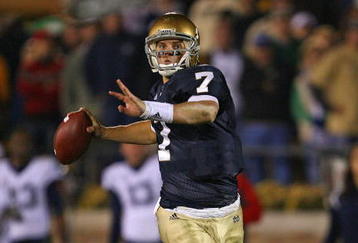 SOUTH BEND, IN - NOVEMBER 21: Jimmy Clausen #7 of the Notre Dame Fighting Irish looks for a receiver in the first overtime period against the Univeristy of Connecticut Huskies at Notre Dame Stadium on November 21, 2009 in South Bend, Indiana. Connecticut defeated Notre Dame 33-30 in double overtime. (Photo by Jonathan Daniel/Getty Images)