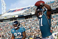 JACKSONVILLE, FL - NOVEMBER 22:  Reciever Mike Sims-Walker #11 and Maurice Jones Drew #32 of the Jacksonville Jaguars celebrate a touchdown against the Buffalo Bills at Jacksonville Municipal Stadium on November 22, 2009 in Jacksonville, Florida.  (Photo by Marc Serota/Getty Images)