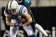 JACKSONVILLE, FL - DECEMBER 18:  Anthony Gonzalez #11 of the Indianapolis Colts is tackled by Drayton Florence #21 of the Jacksonville Jaguars during the game at Jacksonville Municipal Stadium on December 18, 2008 in Jacksonville, Florida.  (Photo by Sam Greenwood/Getty Images)