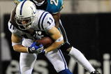 JACKSONVILLE, FL - DECEMBER 18:  Anthony Gonzalez #11 of the Indianapolis Colts is tackled by Drayton Florence #21 of the Jacksonville Jaguars during the game at Jacksonville Municipal Stadium on December 18, 2008 in Jacksonville, Florida.  (Photo by Sam Greenwood/Getty Images)