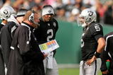 OAKLAND, CA - NOVEMBER 22:  Oakland Raiders head coach Tom Cable speaks to his new starting quarterback Bruce Gradkowski #5 while newly benched quarterback JaMarcus Russell #2 looks on during their game against the Cincinnati Bengals at Oakland-Alameda County Coliseum on November 22, 2009 in Oakland, California.  (Photo by Ezra Shaw/Getty Images)
