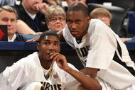 INDIANAPOLIS - MARCH 15:  (L-R) E'Twaun Moore #33 and JaJuan Johnson #25 of the Purdue Boilermakers sit next to the scorer's table as they wait to enter the game against the Ohio State Buckeyes during the final of the Big Ten Men's Basketball Tournament at Conseco Fieldhouse on March 15, 2009 in Indianapolis, Indiana.  (Photo by Jonathan Daniel/Getty Images)