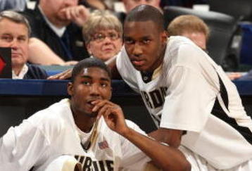 INDIANAPOLIS - MARCH 15:  (L-R) E'Twaun Moore #33 and JaJuan Johnson #25 of the Purdue Boilermakers sit next to the scorer's table as they wait to enter the game against the Ohio State Buckeyes during the final of the Big Ten Men's Basketball Tournament at Conseco Fieldhouse on March 15, 2009 in Indianapolis, Indiana.  (Photo by Jonathan Daniel/Getty Images)