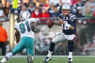 FOXBORO, MA - NOVEMBER 8:  Tom Brady #12 of the New England Patriots looks for an open man against the Miami Dolphins at Gillette Stadium on November 8, 2009 in Foxboro, Massachusetts. (Photo by Jim Rogash/Getty Images)