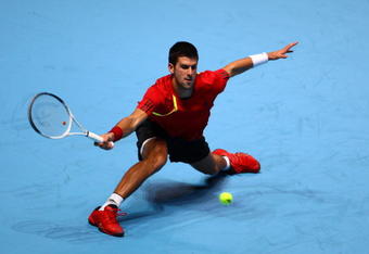 LONDON, ENGLAND - NOVEMBER 23:  Novak Djokovic of Serbia returns the ball during the men's singles first round match against Nikolay Davydenko of Russia  during the Barclays ATP World Tour Finals at the O2 Arena on November 23, 2009 in London, England.  (Photo by Julian Finney/Getty Images)