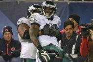 CHICAGO - NOVEMBER 22: LeSean McCoy #29 of the Philadelphia Eagles is lifted by teammate Nick Cole #59 after scoring the game-winning touchdown against the Chicago Bears at Soldier Field on November 22, 2009 in Chicago, Illinois. The Eagles defeated the Bears 24-20. (Photo by Jonathan Daniel/Getty Images)