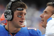 GAINESVILLE, FL - NOVEMBER 21: Quarterback Tim Tebow #15 of the Florida Gators talks with coach Urban Meyer against the Florida International University Golden Panthers, November 21, 2009 at Ben Hill Griffin Stadium in Gainesville, Florida.  (Photo by Al Messerschmidt/Getty Images)