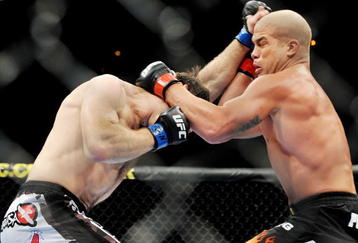 LAS VEGAS - NOVEMBER 21: Tito Ortiz (R) battles Forrest Griffin (L) during their Light Heavyweight Fight at the UFC 106 at Mandalay Bay Events Center on November 21, 2009 in Las Vegas, Nevada. (Photo by Jon Kopaloff/Getty Images)