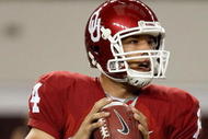 ARLINGTON, TX - SEPTEMBER 05:  Quarterback Sam Bradford #14 of the Oklahoma Sooners drops back to pass against the Brigham Young Cougars at Cowboys Stadium on September 5, 2009 in Arlington, Texas.  (Photo by Ronald Martinez/Getty Images)