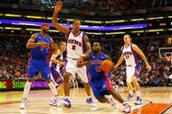 PHOENIX - NOVEMBER 22:  Will Bynum #12 of the Detroit Pistons drives the ball past Channing Frye #8 of the Phoenix Suns during the NBA game at US Airways Center on November 22, 2009 in Phoenix, Arizona. The Suns defeated the Pistons 117-91. NOTE TO USER: User expressly acknowledges and agrees that, by downloading and or using this photograph, User is consenting to the terms and conditions of the Getty Images License Agreement.  (Photo by Christian Petersen/Getty Images)