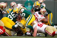 GREEN BAY, WI - NOVEMBER 22: Running back Ryan Grant #25 of the Green Bay Packers runs with the football for a touchdown against the San Francisco 49ers at Lambeau Field on November 22, 2009 in Green Bay, Wisconsin. The Packers defeated the 49ers 30-24. (Photo by Scott Boehm/Getty Images)