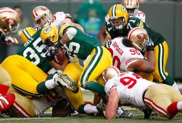 GREEN BAY, WI - NOVEMBER 22: Running back Ryan Grant #25 of the Green Bay Packers runs with the football for a touchdown against the San Francisco 49ers at Lambeau Field on November 22, 2009 in Green Bay, Wisconsin. The Packers defeated the 49ers 30-24. (Photo by Scott Boehm/Getty Images)