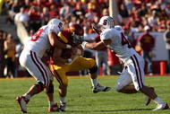 LOS ANGELES - NOVEMBER 14: Defensive tackle Matthew Masifilo #98 and linebacker Will Powers #42 of the Stanford Cardinal tackle quarterback Matt Barkley #7 of the USC Trojans on November 14, 2009 at the Los Angeles Coliseum in Los Angeles, California. Stanford won 55-21. (Photo by Stephen Dunn/Getty Images)