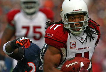 CHICAGO - NOVEMBER 08: Larry Fitzgerald #11 of the Arizona Cardinals shakes off a tackle attempt by Charles Tillman #33 of the Chicago Bears to score a touchdown at Soldier Field on November 8, 2009 in Chicago, Illinois. The aCardinals defeated the Bears 41-21. (Photo by Jonathan Daniel/Getty Images)