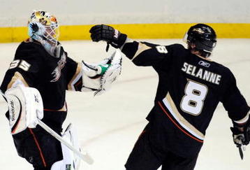 ANAHEIM, CA - NOVEMBER 23:  Teemu Selanne #8 of the Anaheim Ducks celebrates with teammate Jean-Sebastien Giguere #35 goalkeeper after a shootout of the NHL game at the Honda Center on November 23, 2009 in Anaheim, California. Sekanne scored the winning goal after a shootout. (Photo by Kevork Djansezian/Getty Images)