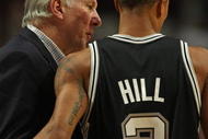 CHICAGO - OCTOBER 29: Head coach Gregg Popovich of the San Antonio Spurs talks with George Hill #3 during a game against the Chicago Bulls at the United Center on October 29, 2009 in Chicago, Illinois. The Bulls defeated the Spurs 92-85. (Photo by Jonathan Daniel/Getty Images)
