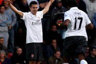 LONDON, ENGLAND - OCTOBER 25:  Robin van Persie of Arsenal celebrates after he scored the first goal during the Barclays Premier League match between West Ham United and Arsenal at Boleyn Ground on October 25, 2009 in London, England.  (Photo by Clive Rose/Getty Images)
