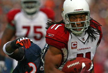 CHICAGO - NOVEMBER 08: Larry Fitzgerald #11 of the Arizona Cardinals shakes off a tackle attempt by Charles Tillman #33 of the Chicago Bears to score a touchdown at Soldier Field on November 8, 2009 in Chicago, Illinois. The aCardinals defeated the Bears 41-21. (Photo by Jonathan Daniel/Getty Images)