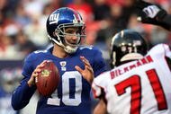 EAST RUTHERFORD, NJ - NOVEMBER 22:  Eli Manning #10 of the New York Giants looks to throw a pass against the Atlanta Falcons on November 22, 2009 at Giants Stadium in East Rutherford, New Jersey.  (Photo by Jim McIsaac/Getty Images)