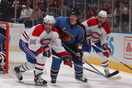 ATLANTA  -  MARCH 8:   Garnet Exelby #2 of the Atlanta Thrashers defends against Guillame Latendresse #84 and  Christopher Higgins #21 of the Montreal Canadiens on March 8, 2007 at Philips Arena in Atlanta, Georgia. (Photo by Scott Cunningham/Getty Images)  