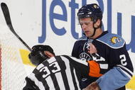 SUNRISE, FL - NOVEMBER 23: Keith Ballard #2 of the Florida Panthers has his mouth checked by referee Kevin Pollock #33 after he was hit by Sidney Crosby #87 (not pictured) of the Pittsburgh Penguins on November 23, 2009 at the BankAtlantic Center in Sunrise, Florida. (Photo by Joel Auerbach/Getty Images)