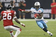 HOUSTON - NOVEMBER 23:  Running Back Chris Johnson #28 of the Tennessee Titans carries the ball against safety Eugene Wilson #26 of the Houston Texans on November 23, 2009  at Reliant Stadium in Houston, Texas.  The Titans won 20-17.  (Photo by Stephen Dunn/Getty Images)
