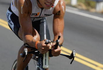 KONA, HI - OCTOBER 16: Normann Stadler of Mannheim, Germany, bikes in the Ironman Triathlon World Championship, October 16, 2004 in Kona, HI.  Stadler won the Ironman Championship race.(Photo by Marco Garcia/Getty Images)