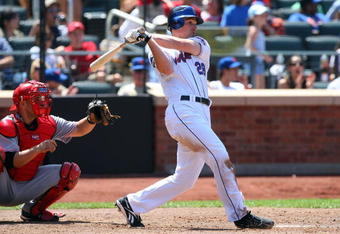 NEW YORK - JULY 12:  Daniel Murphy #28 of the New York Mets hits a RBI single in the fourth inning against the Cincinnati Reds on July 12, 2009 at Citi Field in the Flushing neighborhood of the Queens borough of New York City.  (Photo by Jim McIsaac/Getty Images)