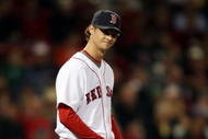 BOSTON - SEPTEMBER 29:  Clay Buchholz #61 of the Boston Red Sox reacts after giving up a two run homer in the first inning against the Toronto Blue Jays on September 29, 2009 at Fenway Park in Boston, Massachusetts.  (Photo by Elsa/Getty Images)
