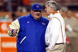 AUSTIN, TX - NOVEMBER 21:  Head coach Mark Mangino of the Kansas Jayhawks talks with Mack Brown of the Texas Longhorns at Darrell K Royal-Texas Memorial Stadium on November 21, 2009 in Austin, Texas.  (Photo by Ronald Martinez/Getty Images)