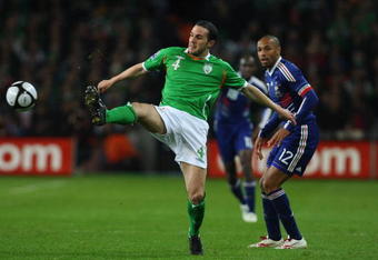 DUBLIN, IRELAND - NOVEMBER 14:  France forward  Thierry Henry looks on as Ireland defender John O'Shea intercepts a ball during the FIFA 2010 World Cup Qualifier play off first leg between Republic of Ireland and France at Croke Park   on November 14, 2009 in Dublin, Ireland.  (Photo by Stu Forster/Getty Images)