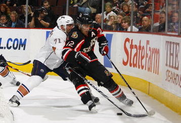 OTTAWA, CANADA - NOVEMBER 10:  Lubomir Visnovsky #71 of the Edmonton Oilers battles with Mike Fisher #12 of the Ottawa Senators as he tries to carry the puck behind the net in a game at Scotiabank Place on November 10, 2009 in Ottawa, Ontario, Canada. The Edmonton Oilers and the Ottawa Senators were tied 2-2 after two periods. (Photo by Phillip MacCallum/Getty Images)