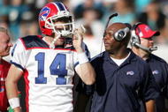 JACKSONVILLE, FL - NOVEMBER 22:  Head Coach Perry Fewell  and quarterback Ryan Fitzpatrick #14 of the Buffalo Bills watches his team  against the Jacksonville Jaguars at Jacksonville Municipal Stadium on November 22, 2009 in Jacksonville, Florida.  Jacksonville defeated Buffalo 18-15.  (Photo by Marc Serota/Getty Images)