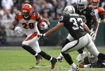 OAKLAND, CA - NOVEMBER 22: Bernard Scott #28 of the Cincinnati Bengals runs against Tyvon Branch #33 of the Oakland Raiders during an NFL game at Oakland-Alameda County Coliseum on November 22, 2009 in Oakland, California.  (Photo by Jed Jacobsohn/Getty Images)