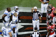 ATLANTA, GA - SEPTEMBER 7: NFL referee Ron Winter tosses the coin as the Atlanta Falcons host the Detroit Lions at the Georgia Dome on September 7, 2008 in Atlanta, Georgia.  (Photo by Al Messerschmidt/Getty Images) 