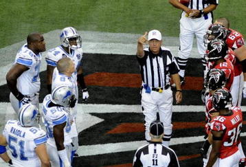 ATLANTA, GA - SEPTEMBER 7: NFL referee Ron Winter tosses the coin as the Atlanta Falcons host the Detroit Lions at the Georgia Dome on September 7, 2008 in Atlanta, Georgia.  (Photo by Al Messerschmidt/Getty Images) 