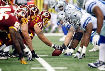 ARLINGTON, TX - NOVEMBER 22:  The Washington Redskins offensive line prepares to snap the ball against the Dallas Cowboys at Cowboys Stadium on November 22, 2009 in Arlington, Texas.  (Photo by Ronald Martinez/Getty Images)