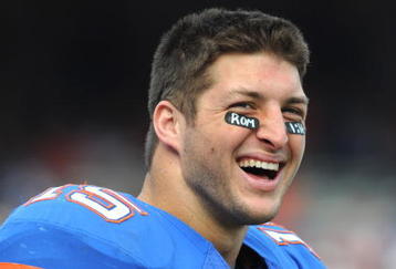GAINESVILLE, FL - NOVEMBER 21: Quarterback Tim Tebow #15 of the Florida Gators watches fourth-quarter play against the Florida International University Golden Panthers, November 21, 2009 at Ben Hill Griffin Stadium in Gainesville, Florida.  (Photo by Al Messerschmidt/Getty Images)