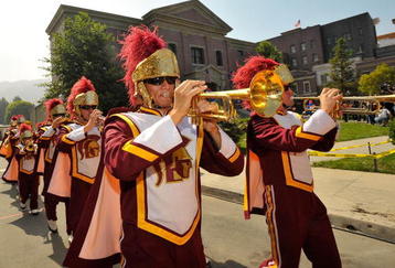 UNIVERSAL CITY, CA - JUNE 18:  The USC marching band performs at celebration of the re-opening of Courthouse Square at Universal Studios Hollywood on June 18, 2009 in Universal City, California. Courthouse Square has been fully restored following a four acre backlot fire in June 2008. The Square has been featured in movies such as 'Back to the Future,' 'Gremlins,' and 'Bye Bye Birdie.'  (Photo by Charley Gallay/Getty Images)