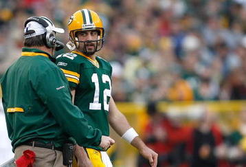 GREEN BAY, WI - NOVEMBER 22: Quarterback Aaron Rogers #12 of the Green Bay Packers talks with head coach Mike McCarthy against the San Francisco 49ers at Lambeau Field on November 22, 2009 in Green Bay, Wisconsin. The Packers defeated the 49ers 30-24. (Photo by Scott Boehm/Getty Images)